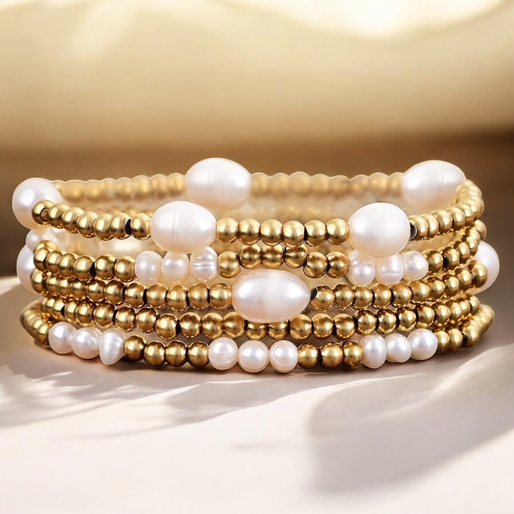 Conjunto de pulseras de oro y perlas