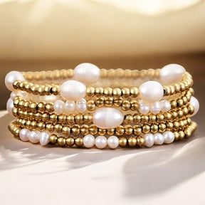 Conjunto de pulseras de oro y perlas