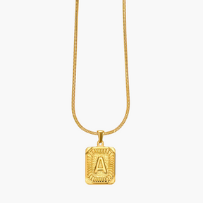 Collar con inicial de burbuja con brillo dorado