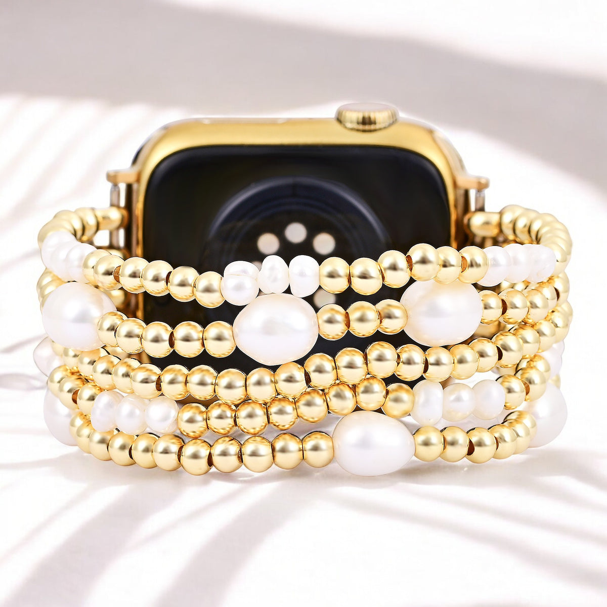 Correa elástica de oro y perla para Apple Watch